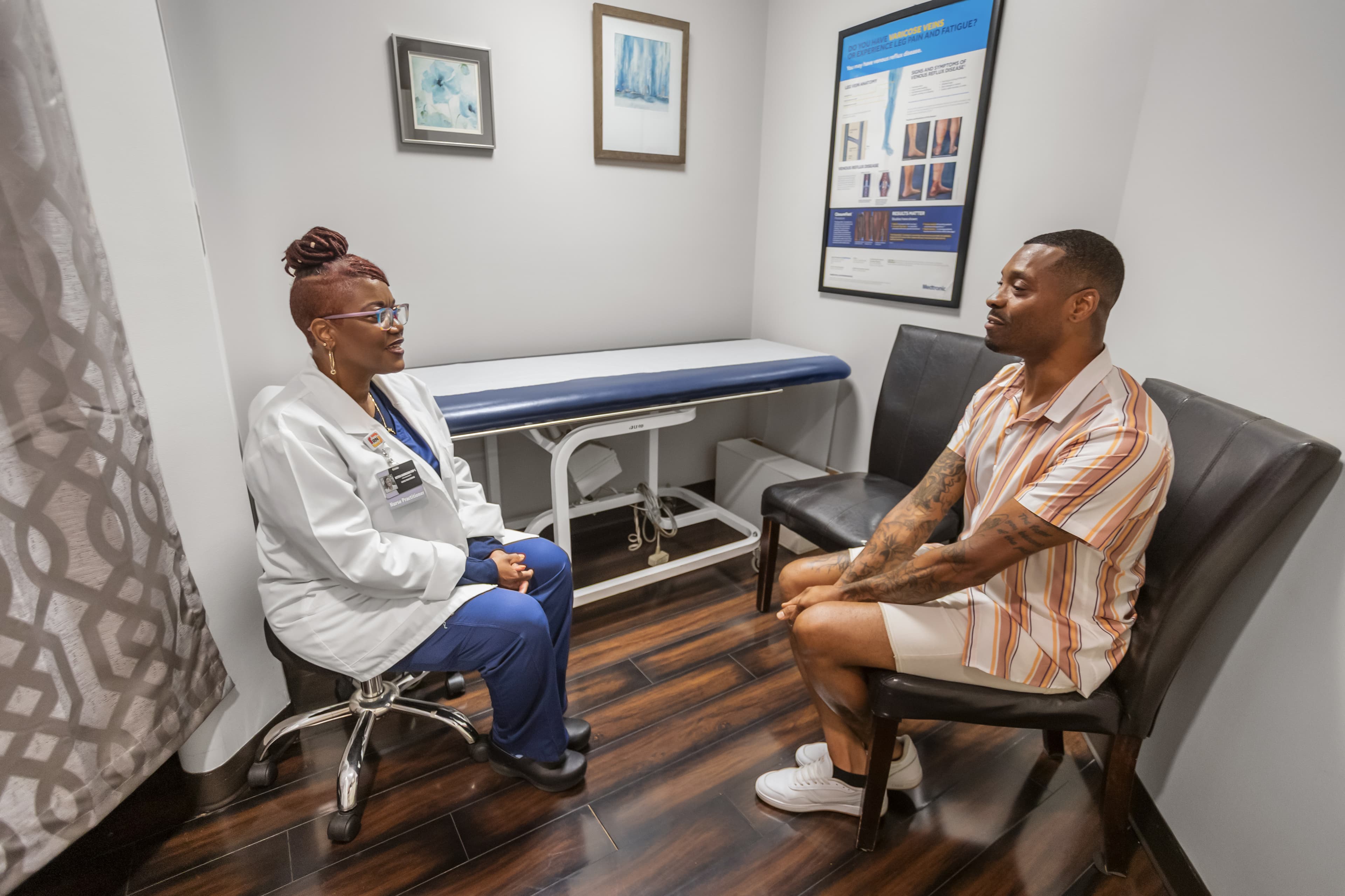 Integrity provider meeting with a patient in an exam room